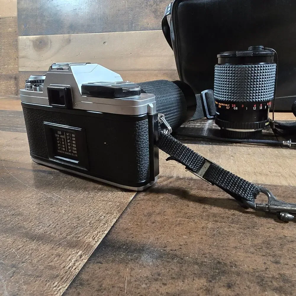 Minolta X370 with a JC Penny f=80 to 200mm zoom lens and prospect f=28-70mm lens